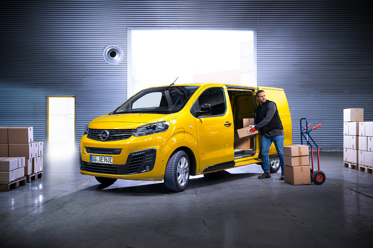 Generate an image of a 2028 opel vivaro-e pro van. the vehicle should be  all-electric with a sleek, modern, aerodynamic design. it should have led  lights and a spacious interior visible through