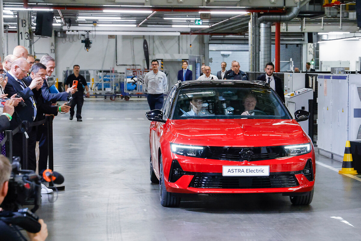 German Chancellor Olaf Scholz drives the fully electric Opel Astra off the production line at the Rüsselsheim plant.
